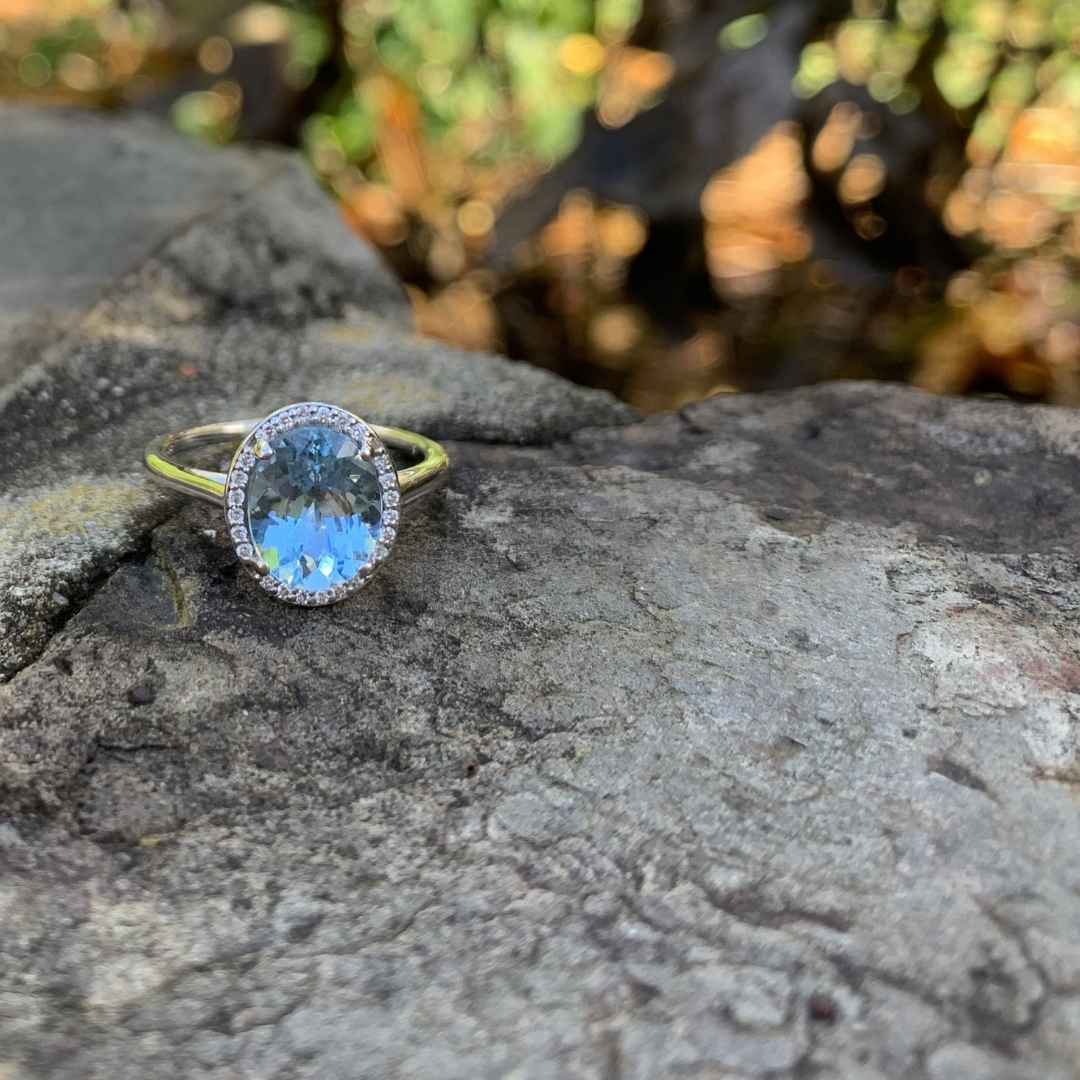 Women's aquamarine oval halo engagement ring 