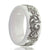 white wedding ring with a pattern on it