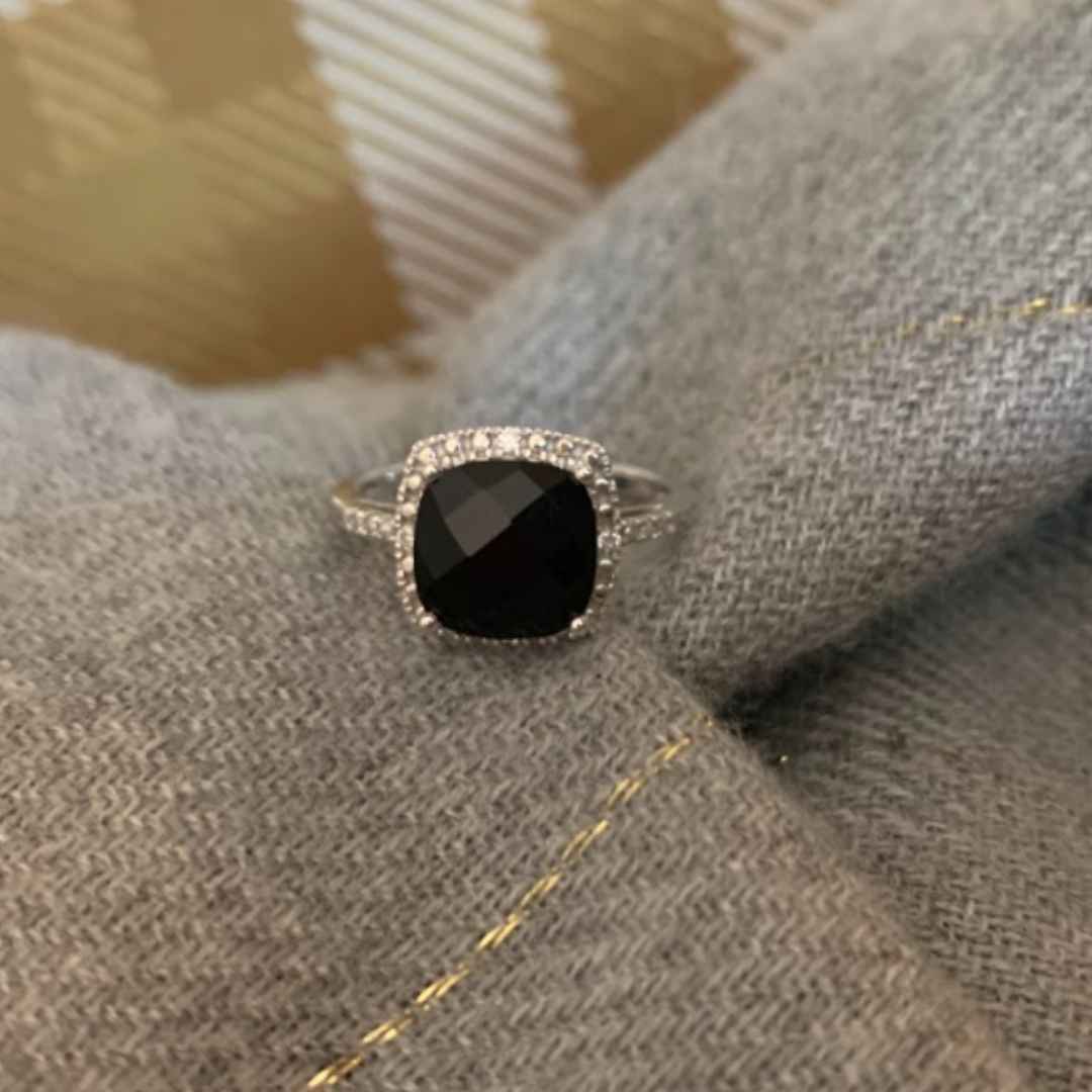 Onyx engagement ring with halo of diamonds and beads
