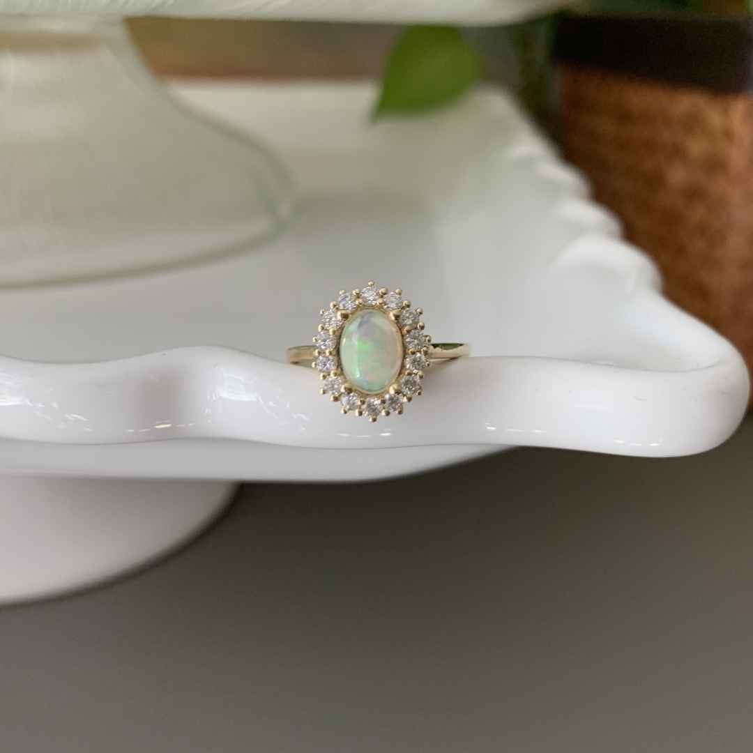Women's 14K white gold Ethiopian Opal and diamond halo engagement ring