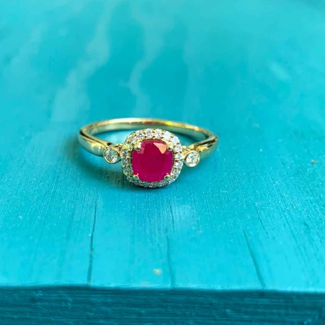 Women's 14k yellow gold ruby engagement ring with halo