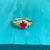 Women's 14k yellow gold ruby engagement ring with halo