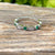 Women's 14k white gold diamond and emerald wedding ring